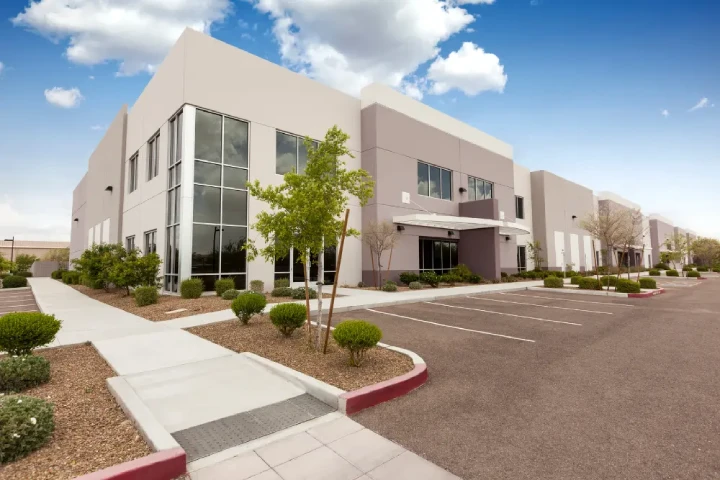 Office Building Inspections in New York, Modern office real estate with large windows, landscaped walkways