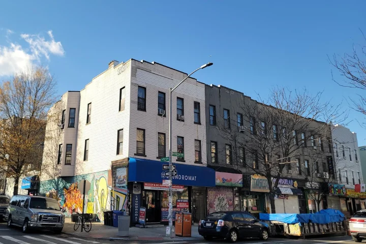 Mixed-Use Property Inspections in New York, Two inspector examine a window during an inspection
